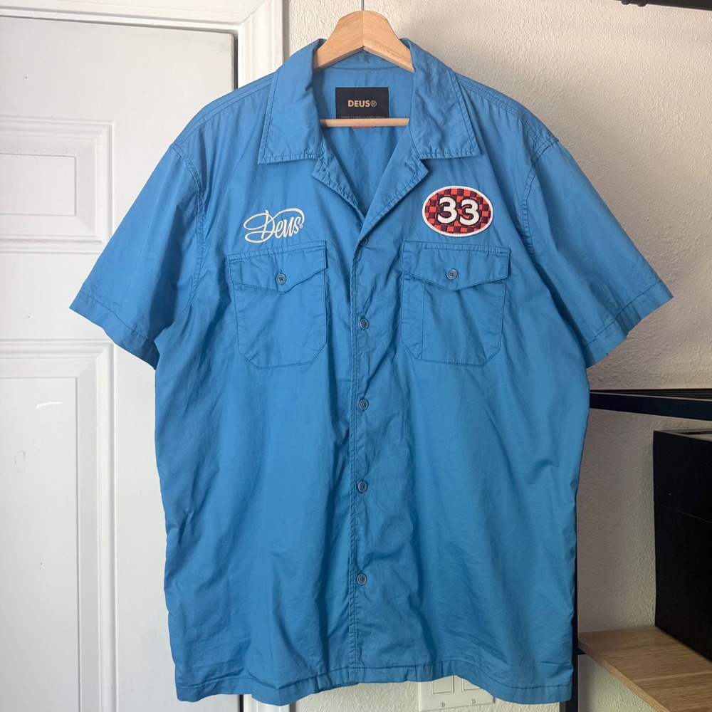 DEUS EX MACHINA blue cotton logo patch racing boxy short sleeve button up shirt